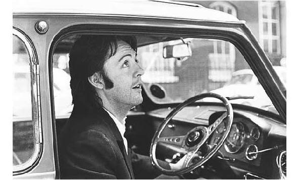 Paul McCartney at the wheel of his Mini DeVille while leaving the Apple Records headquarters, London, in April 1969. Pic: Getty Images