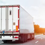 Navigating Financial Highways: A Guide to Truck Factoring for New Trucking Businesses trucking company operator on the highway